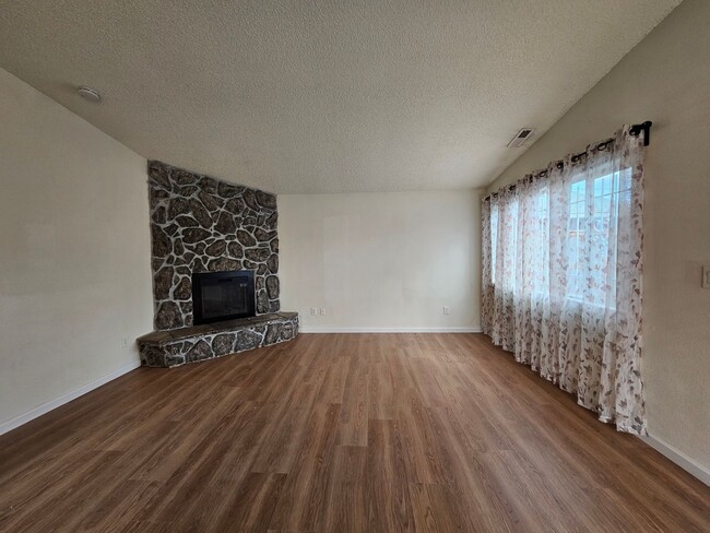 Building Photo - Charming Single-Level Home Featuring New Hardwood Floors, Bright Bedrooms & Open-Concept Living