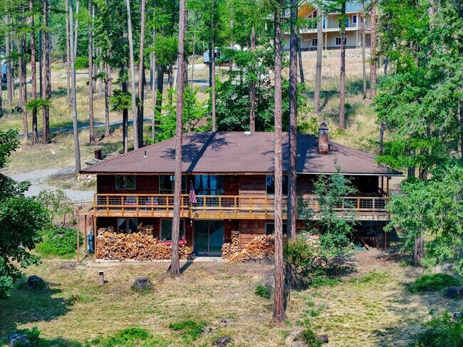 Building Photo - 2700 + sq ft family home has it all! Over 2 acres of land and a stunning view of Lake Pend Oreille