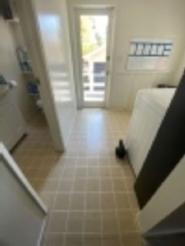 11. Back door; Left- Half bath; Right- Laundry room - 680 Highland St