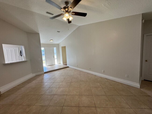 Building Photo - Spacious 3/2 Home with Screened Patio and Large Yard *Lawn Care Included!*