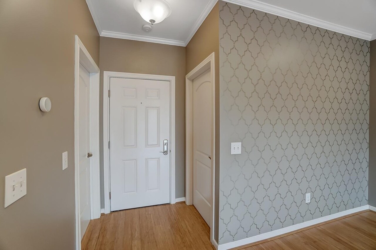 Entrance into the condo unit with the laundry room to the left and spacious coat closet to the right - 3316 Wasson Rd