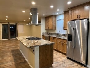 Building Photo - Simply gorgeous 3/2 with 2 car garage, dog...