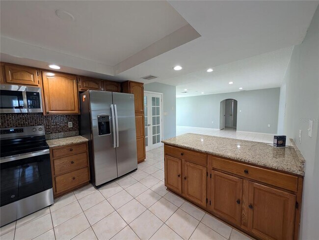 Building Photo - 6947 Bottle Brush Dr