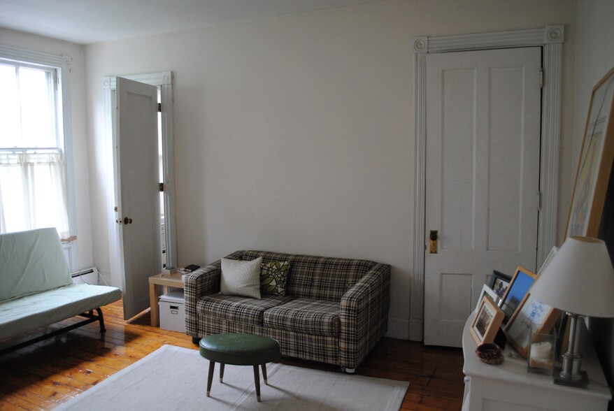 Living room looking at the door to bedroom 2 - 204 Wooster St