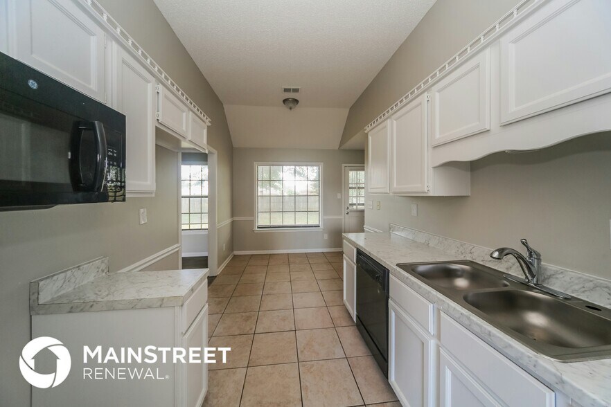 Building Photo - 6740 Stewart Forest Cove E