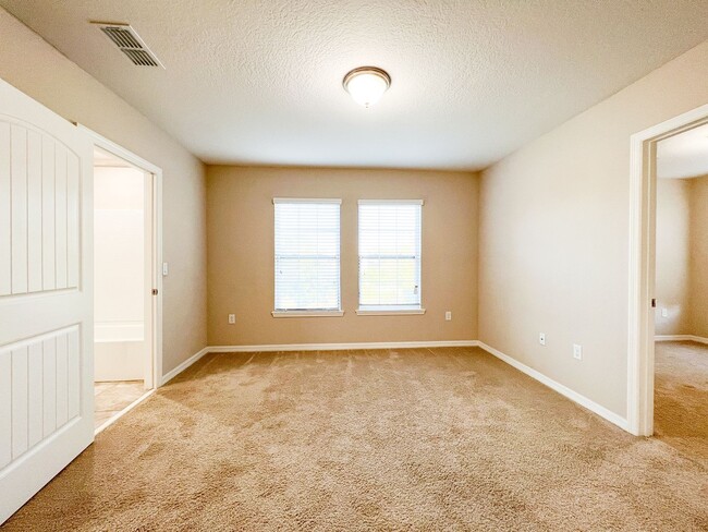 Building Photo - Spacious 4-Bedroom Townhome in Harmony – A Perfect Blend of Nature & Comfort!