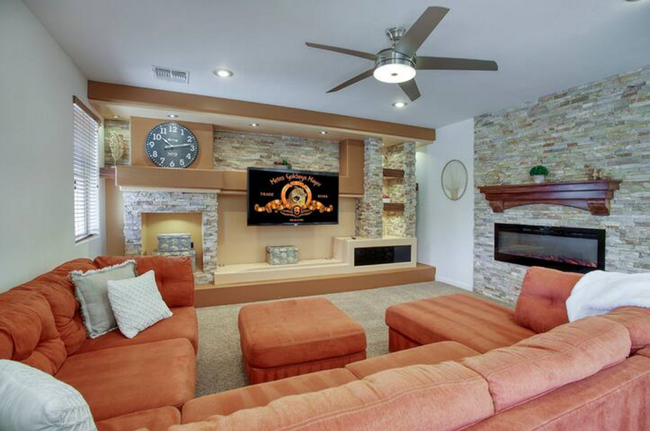 Living Room with Fireplace & TV - 5831 W Plum Rd