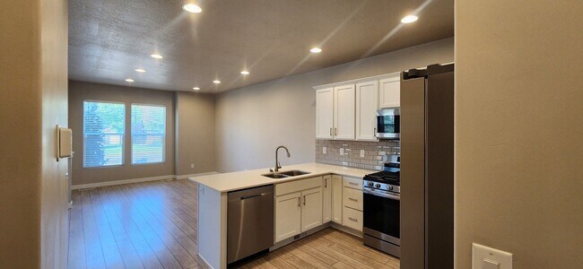 Building Photo - $2,000 OFF 4-bed, 3.5-bath Townhome Available Now!