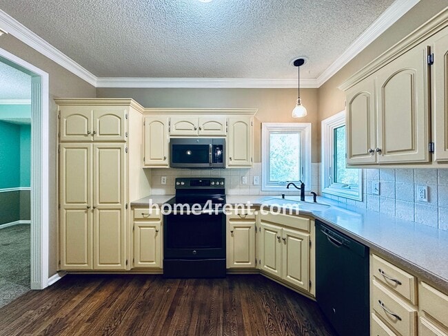 Building Photo - Blue Valley Schools w/ Wood Floors, Finished Basement and a Peaceful, Private Fenced Yard!