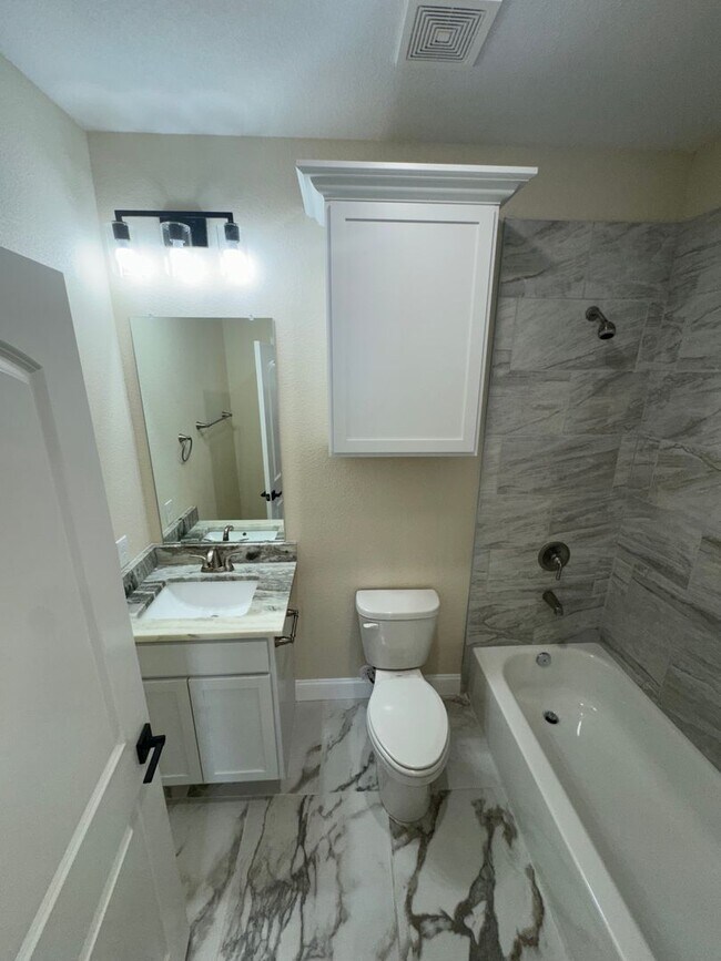 Building Photo - COMING SOON.....Modern Townhome with private fenced yard! HIGH CEILINGS PETS WELCOME