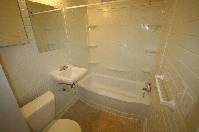 Building Photo - Walltown duplex with gleaming floors, a front porch, and a large pantry — all under $1,300.