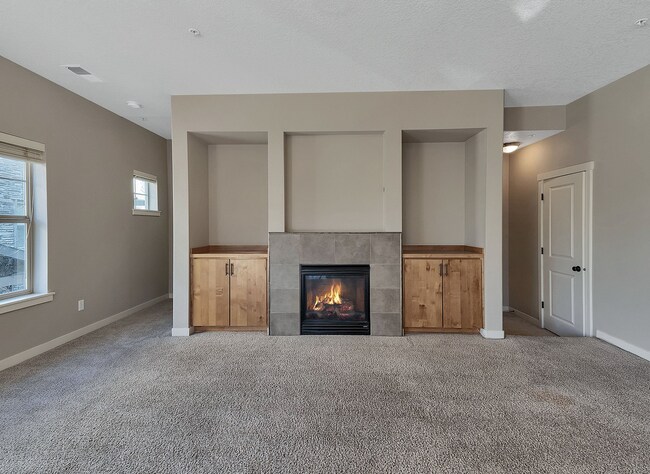 Building Photo - 2BR + 2.1BA Corner Townhome-Style Condo — Dual Primary Suites, Attached Garage & Most Utilities I...