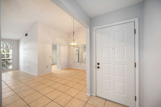 Building Photo - Beautiful Must See!! 3/2 Plus Sunroom & Garage!!  Gated Community!!