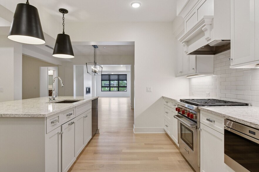 Kitchen flows seamlessly into the dining and living spaces. - 222 Ferndale Rd S
