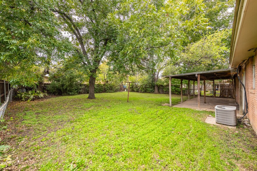 Side yard into backyard. - 1816 E Tucker Blvd
