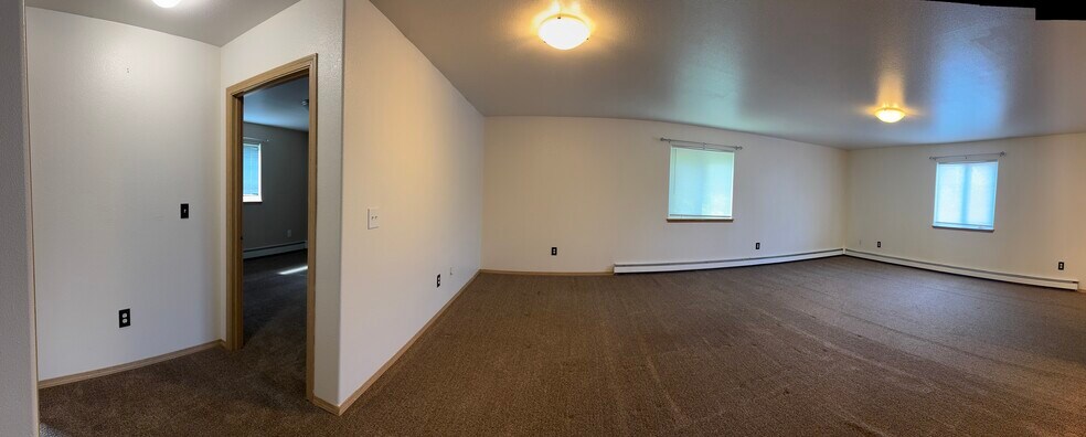 Expansive living room with multiple windows for great natural light. - 2979 Badger Rd