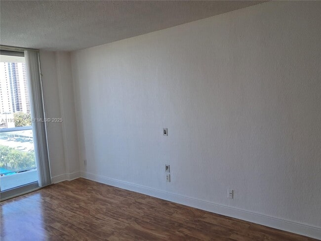 Building Photo - 19380 Collins Ave