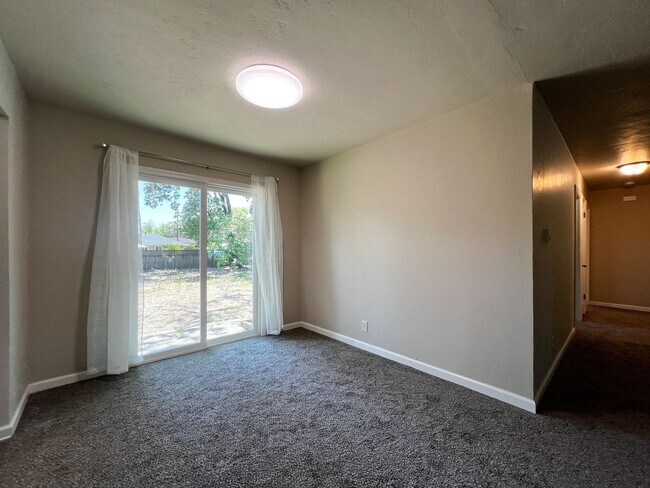Building Photo - Freshly Renovated 3 Bedroom Home with Large Fenced Yard & Double Garage