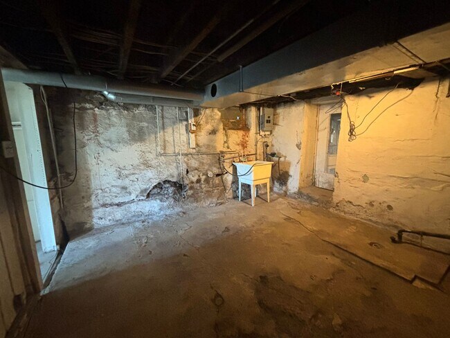 Building Photo - Updated flooring, finished basement, and g...