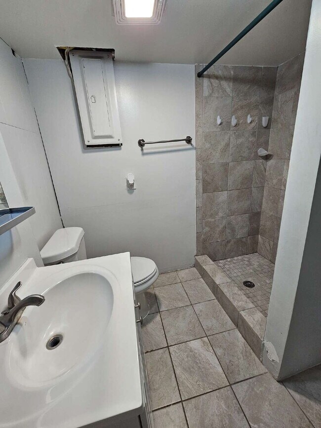Building Photo - 3-Bedroom, 2-Bathroom Ranch with Hardwood Flooring, Tiled Kitchen and Finished Basement with a 2 ...