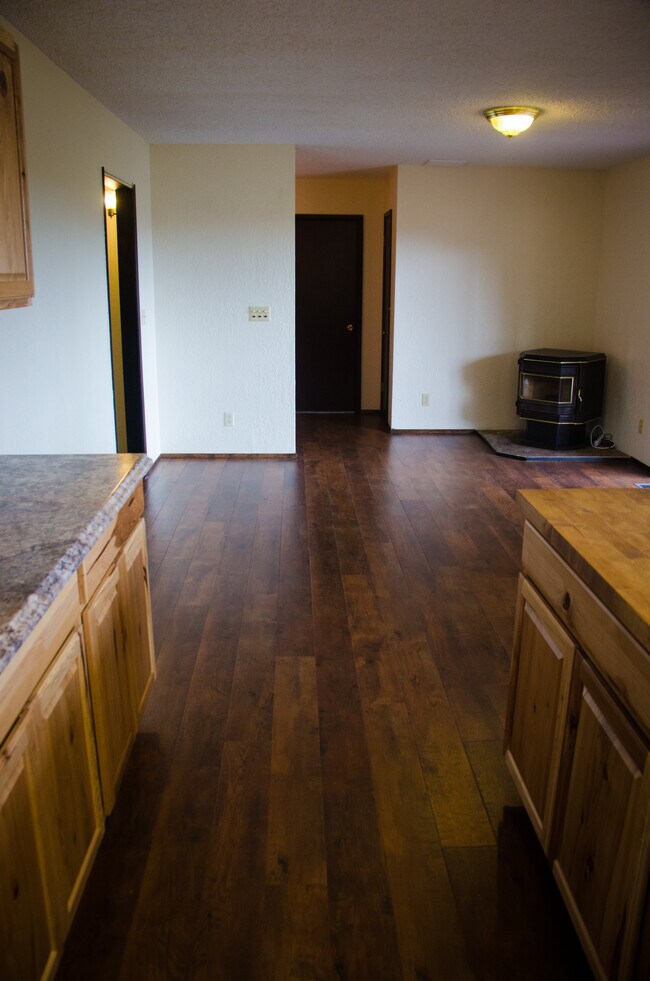 Upstairs pellet stove, exit to deck on the right. - 11839 Glenwood Rd