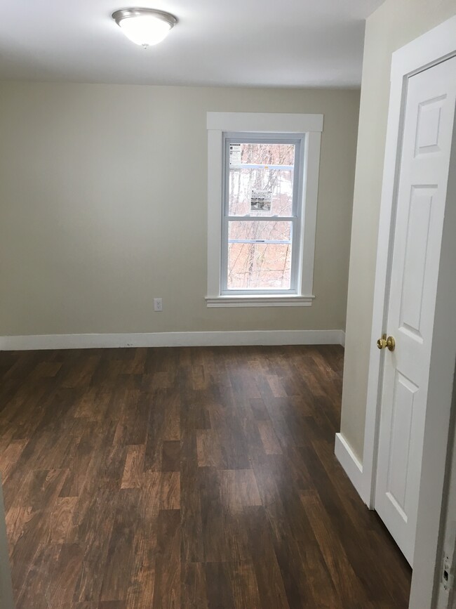 Bedroom on lower level. Flooring goes throughout. New windows. - 36 Westminster Hill Rd