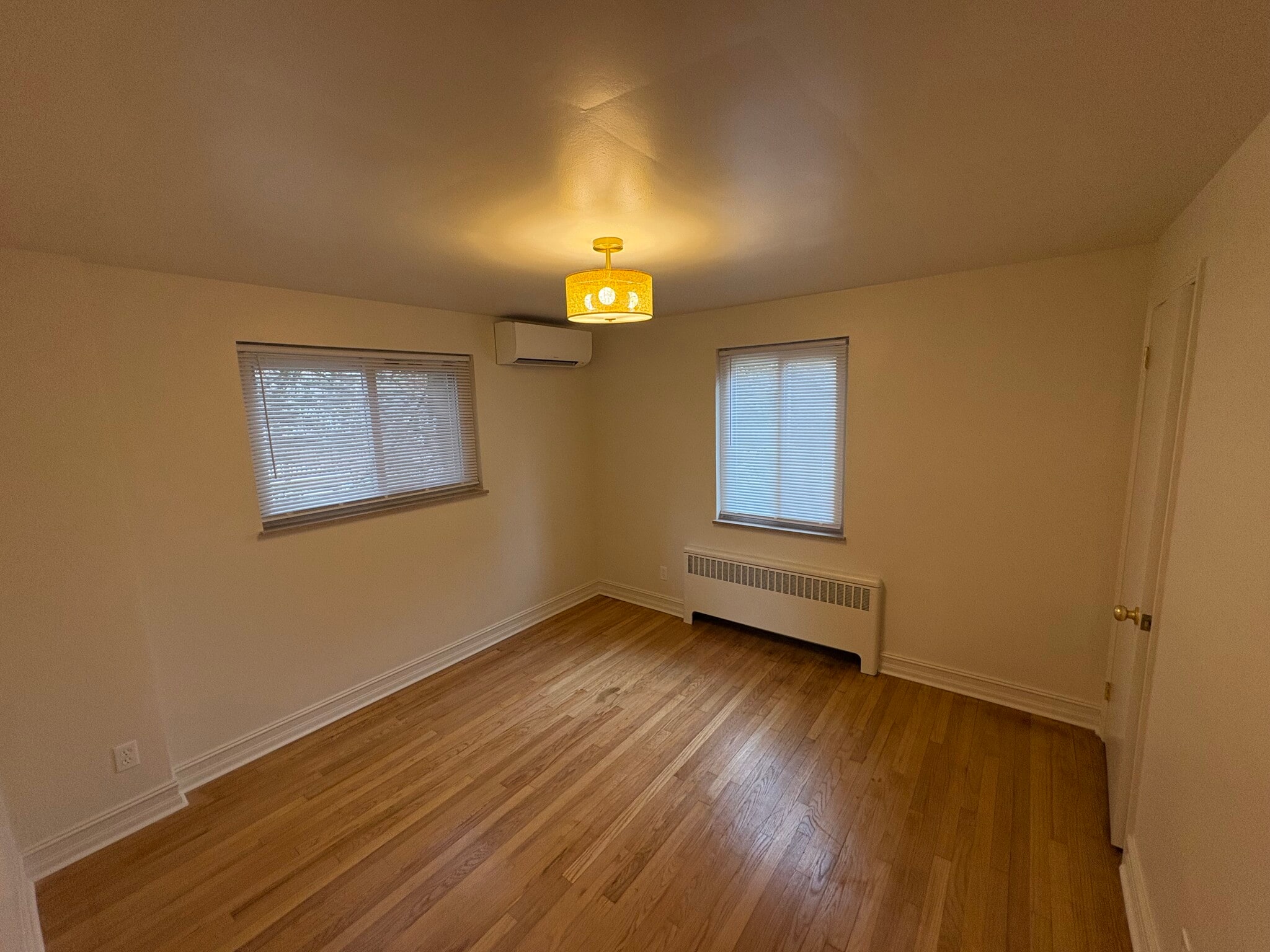Large bedroom with hardwood floors - 6035 Oakwood Ave