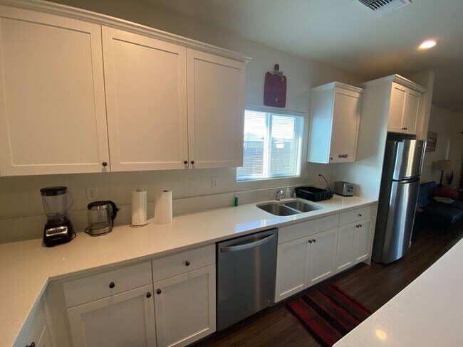 Building Photo - Welcome to the Best Deal in Town. Fully furnished 4 BD 2 BA house on a corner lot