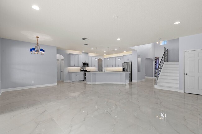 Building Photo - Spacious 6-Bedroom Home Near Lake Nona | 3-Car Garage + Tesla Charger
