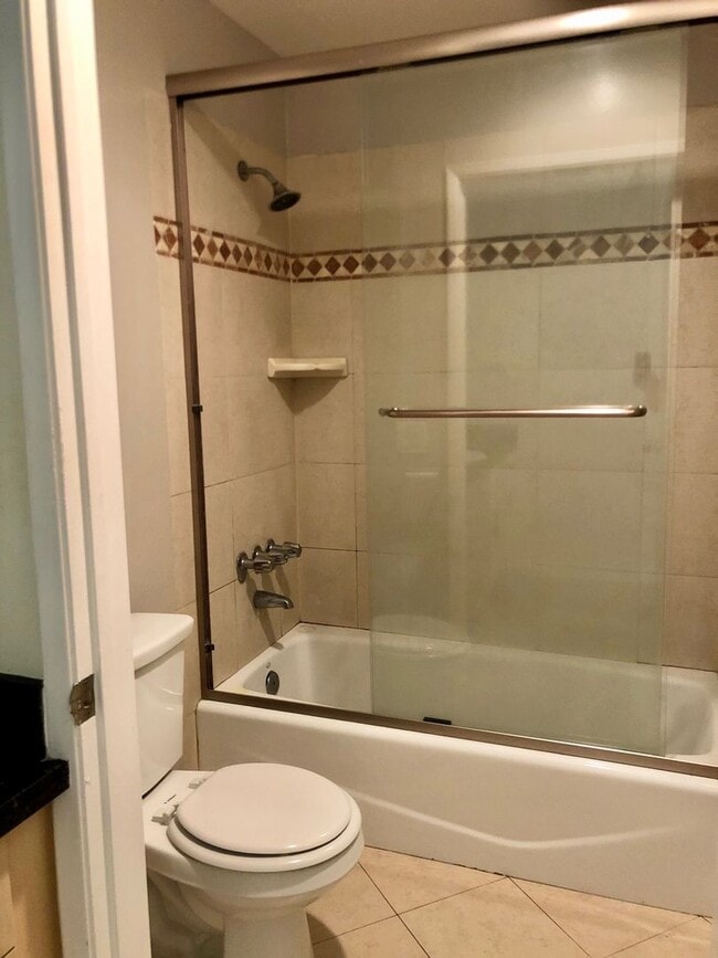 Building Photo - REMODELED CONDO WITH WOOD FLOORS! NEW KITCHEN! FIREPLACE! GYM, POOL! REC ROOM AND MORE