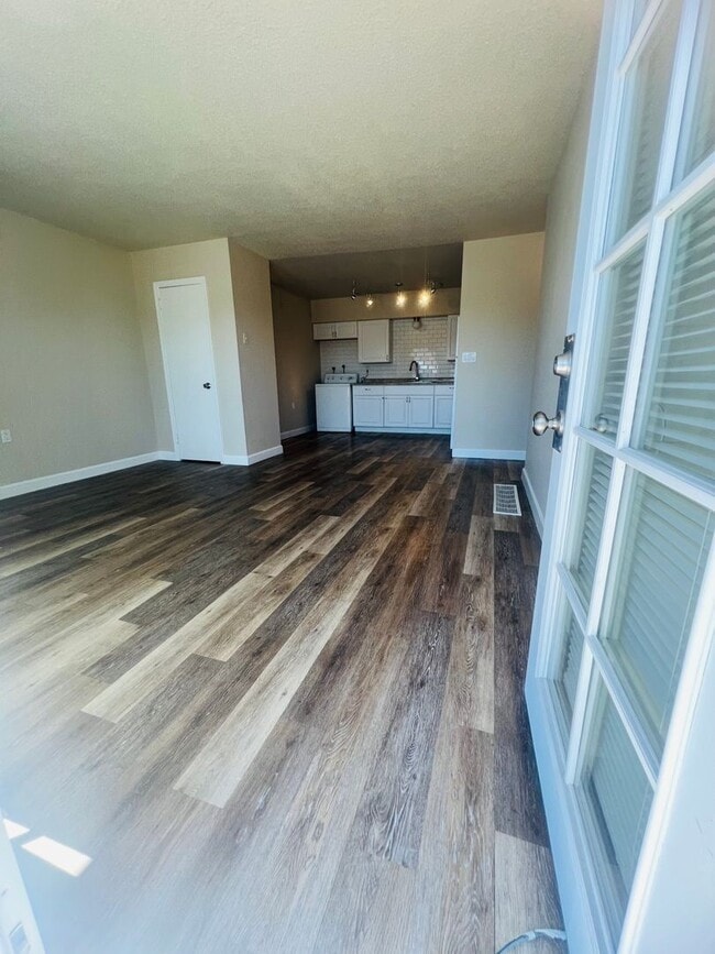 Building Photo - Freshly Painted 3 bed 1 bath with fenced front yard minutes from Fort Carson . $300.00 off the fi...