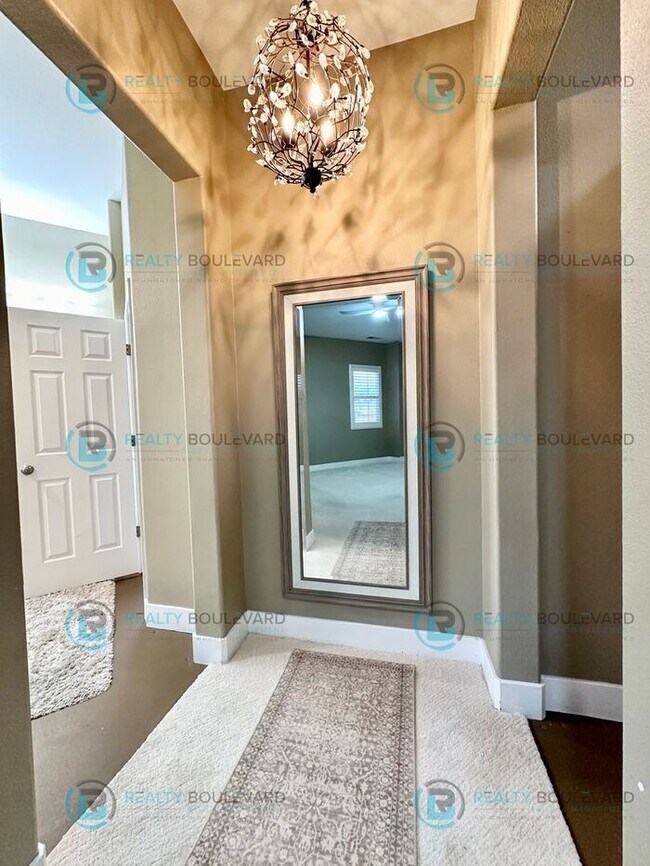 Building Photo - Open Kitchen, Expansive Living, and Covered Patio in Tranquil South Reno Near Trails, Parks & Sho...