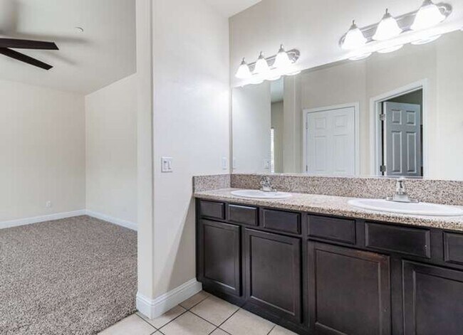 Building Photo - Four bedroom/2-bath home with 2-car garage