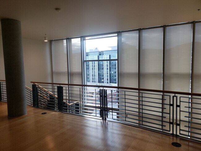 Building Photo - Wonderful Two story Penthouse Condo! Water...