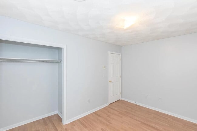 Bedroom #1 One of three bedrooms upstairs, all similar (closet doors not pictured but installed) - 1105 Golfview Dr