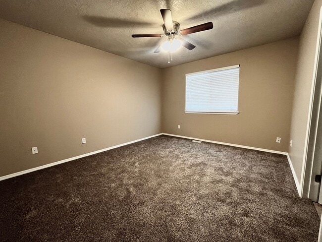 Building Photo - 4 Bedroom Home with Bonus Room Potential & RV Parking!