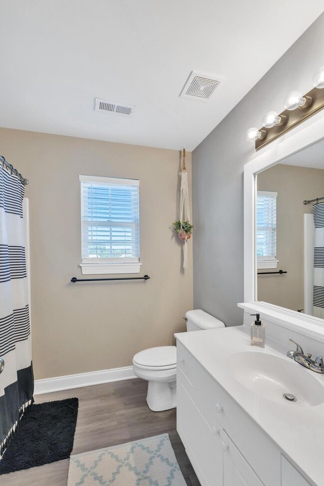 Building Photo - Updated coastal townhome- fully furnished!