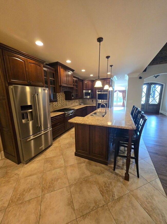 Building Photo - Luxury 4-Bedroom Home with Outdoor Oasis i...