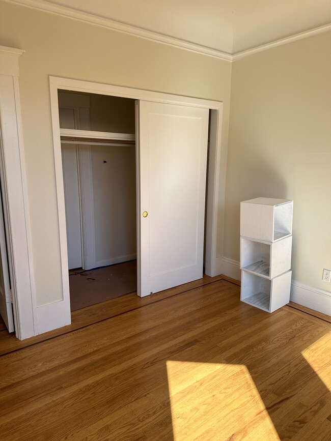 Bedroom # 1double closet with Red Oak inlay mahogany inlay hardwood floor re-finished - 1271 10th Ave