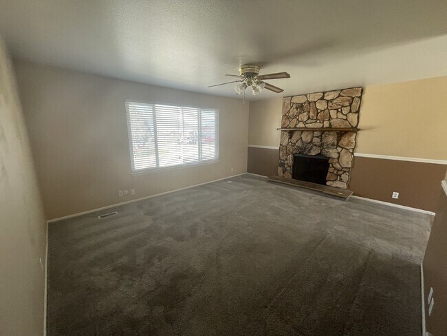 Building Photo - Spacious 6-Bed Oasis with Finished Basement & Cozy Fireplace.