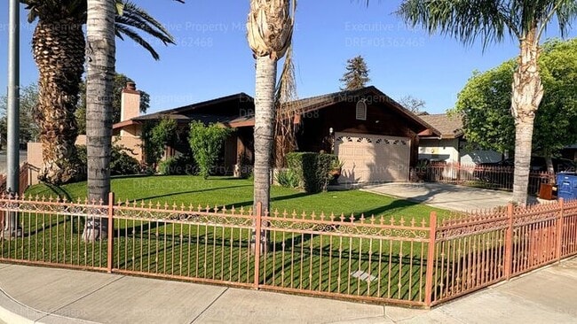 Building Photo - 3 bedroom 2 bathroom home on a corner lot with extra fenced parking.