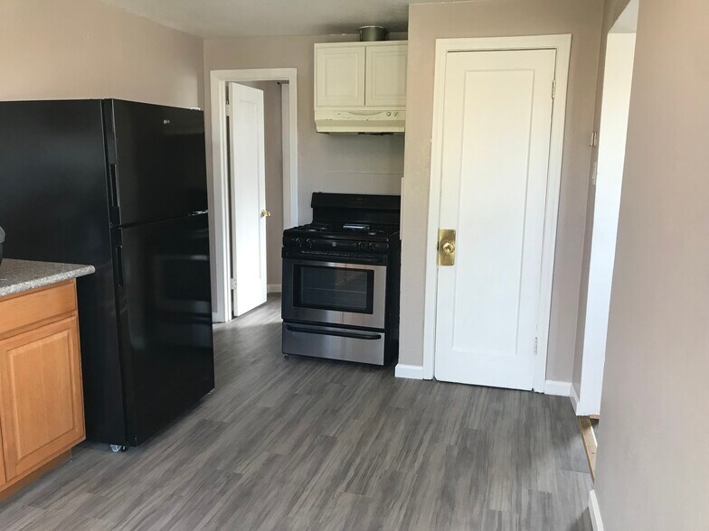 Kitchen leading to bathroom - 461 W 10th St