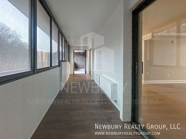 Building Photo - Luxury 1-Bedroom Penthouse with Modern Ren...