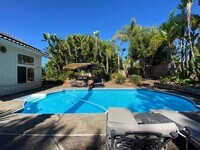 Building Photo - Stunning 4 bedroom Home with a Pool locate...