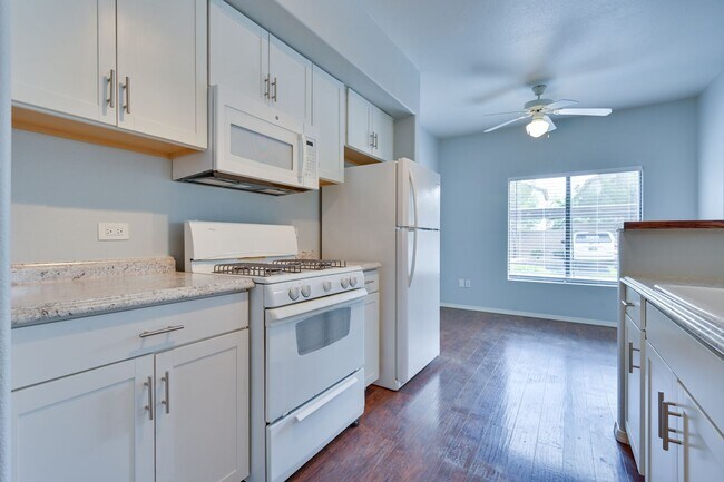 Building Photo - NW!! Gated!!! Clubhouse!!!Community Pool!!! 1st Floor Condo!!! Wood like floors!! No Carpet!!