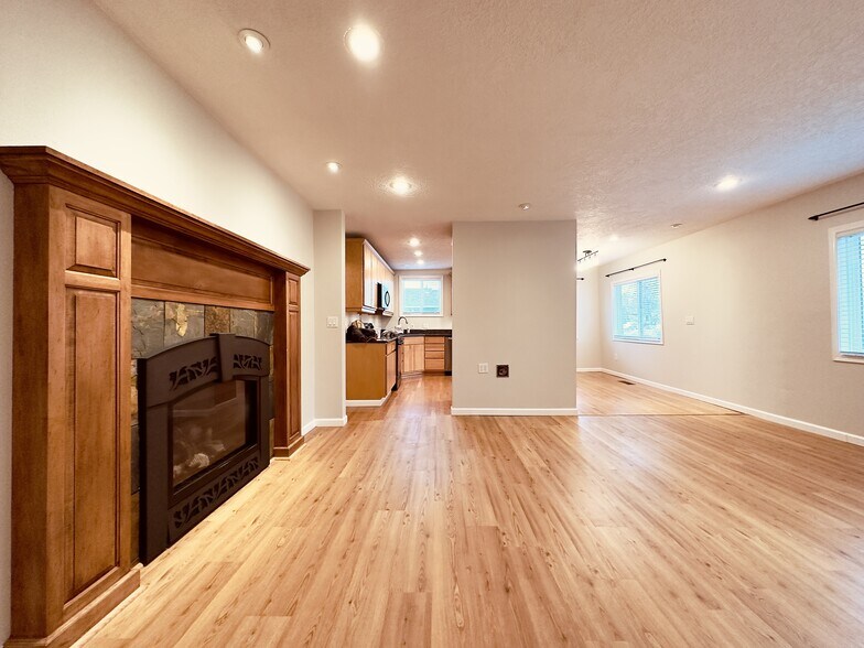 Living room with gas fireplace - 8717 NE Webster St