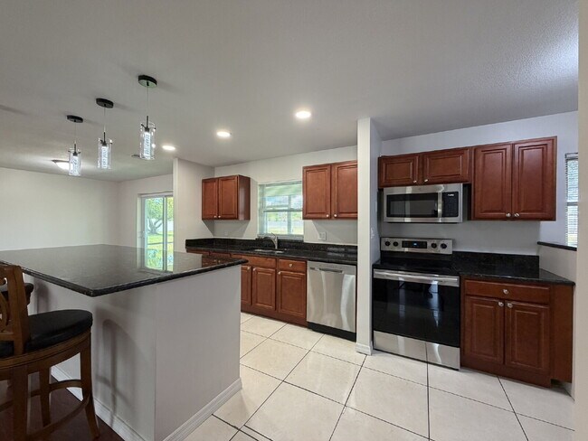 Building Photo - "Charming 3-Bedroom Home with Gleaming Hardwood Floors!"