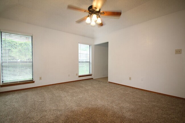 Building Photo - Corner Lot Charmer Off Chapel Creek | 4BR/2BA with Fireplace, Garden Tub & Fenced Backyard