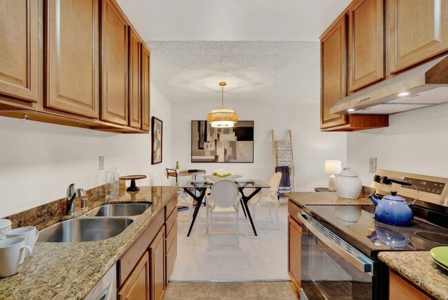 Building Photo - Modern 2-Bedroom Condo with Pool and Koi Pond Views