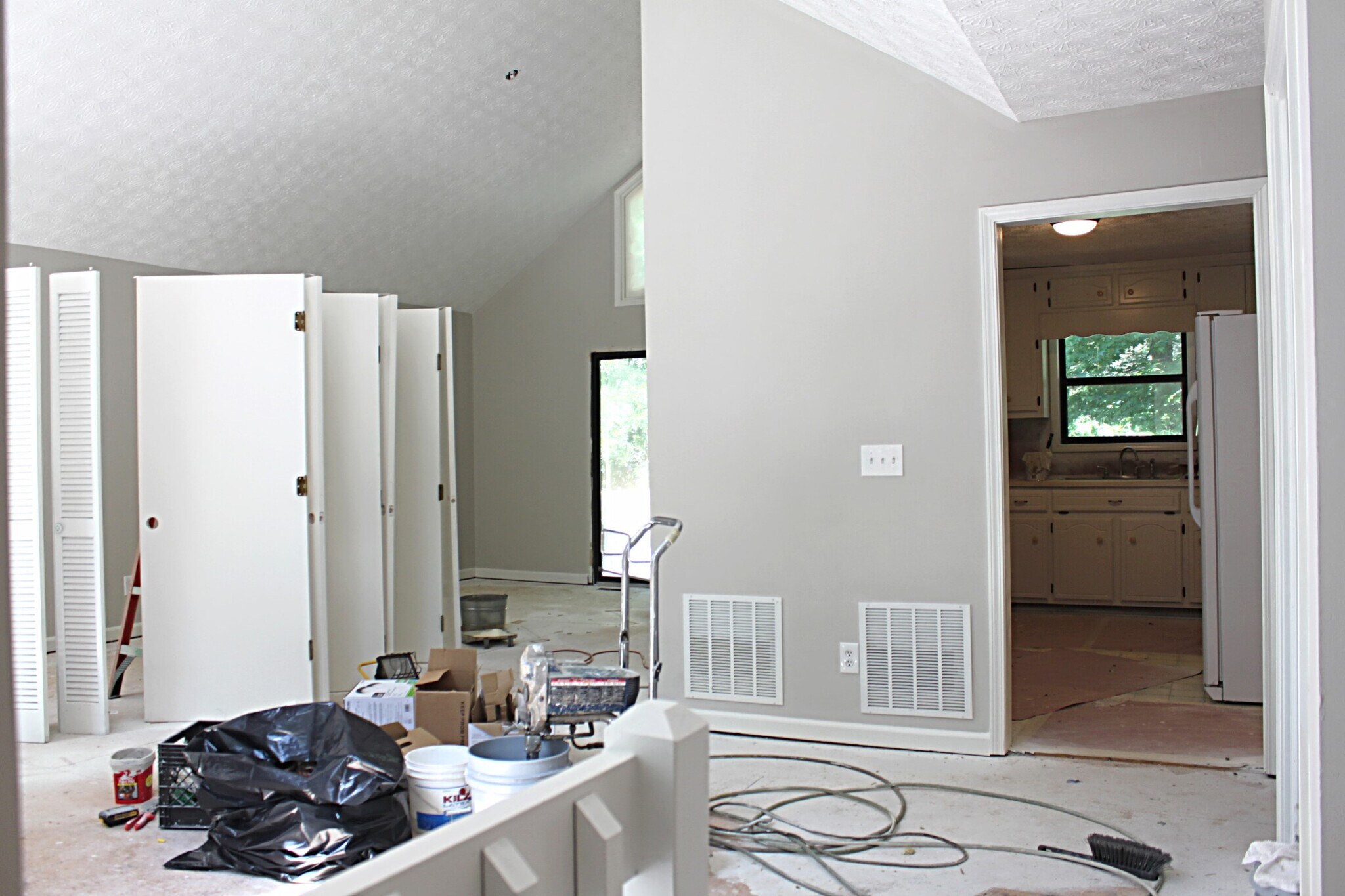 View of Living Room, Dining, and Kitchen from Foyer/Front Entry. - 1095 Mountain Springs Dr NW